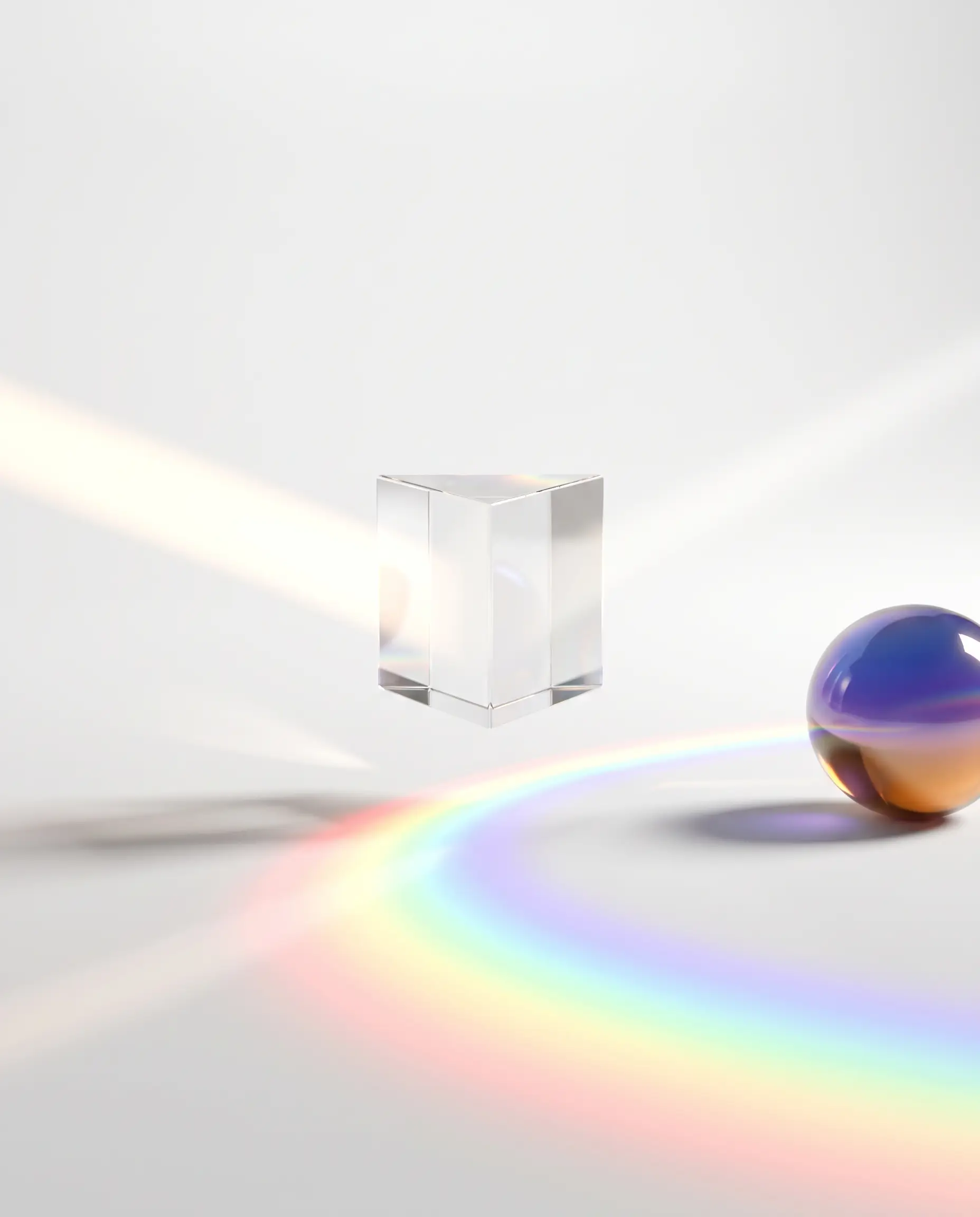A glass prism splitting white light into a soft rainbow spectrum